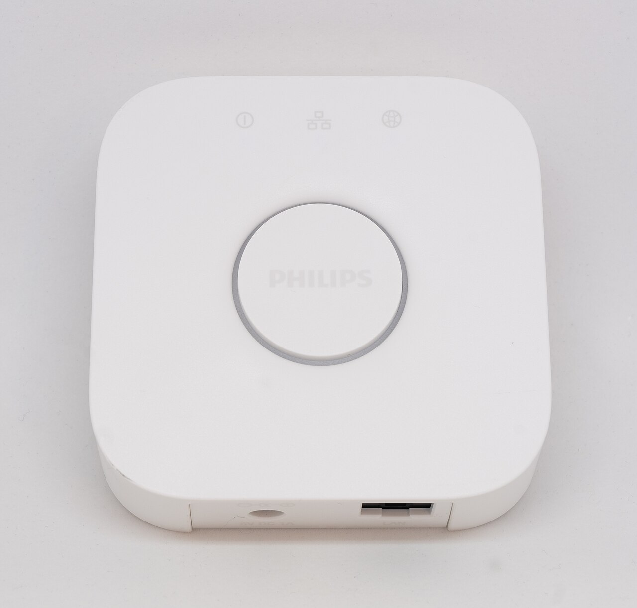 Philips Hue Bridge smart-lighting hub on a pale background.